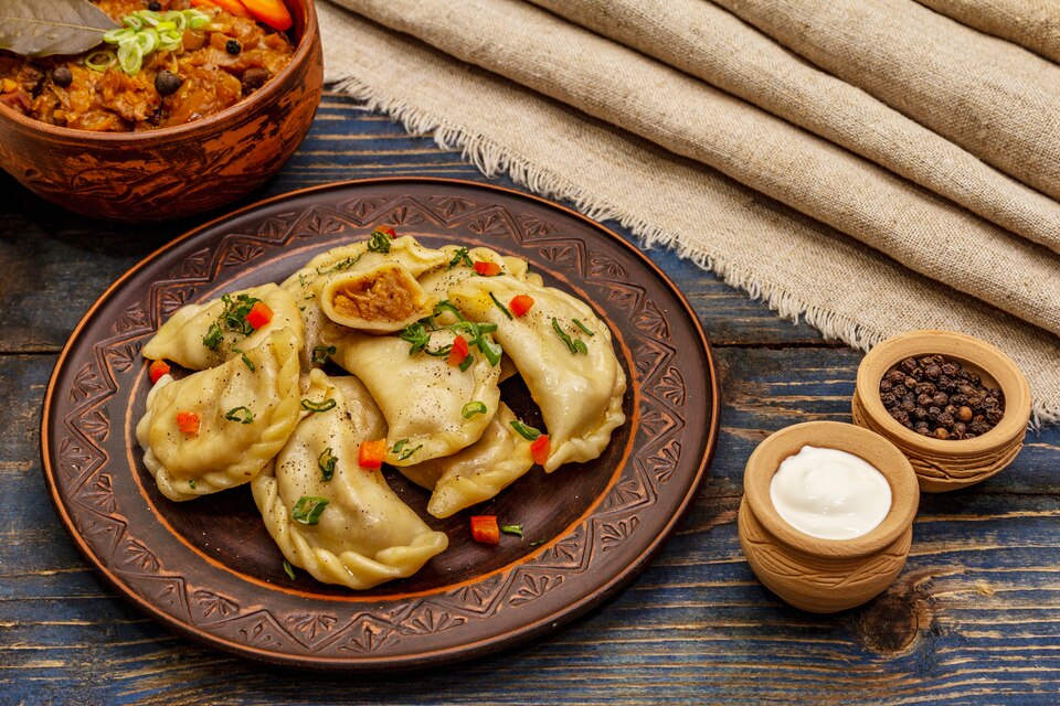 dumplings-stuffed-stewed-cabbage-sour-cream-traditional-ukrainian-dish-varenyky-large