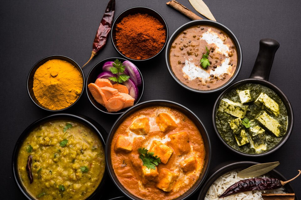 indian-lunch-dinner-main-course-food-group-includes-paneer-butter-masala-dal-makhani-palak-paneer-roti-rice-etc-selective-focus-large